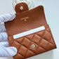 CHANEL 23A Caramel Brown Caviar Classic Small Snap Card Holder Light Gold Hardware is