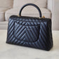 CHANEL Black Caviar Chevron Large Coco Handle 29 cm Flap Bag Brushed Gold Hardware