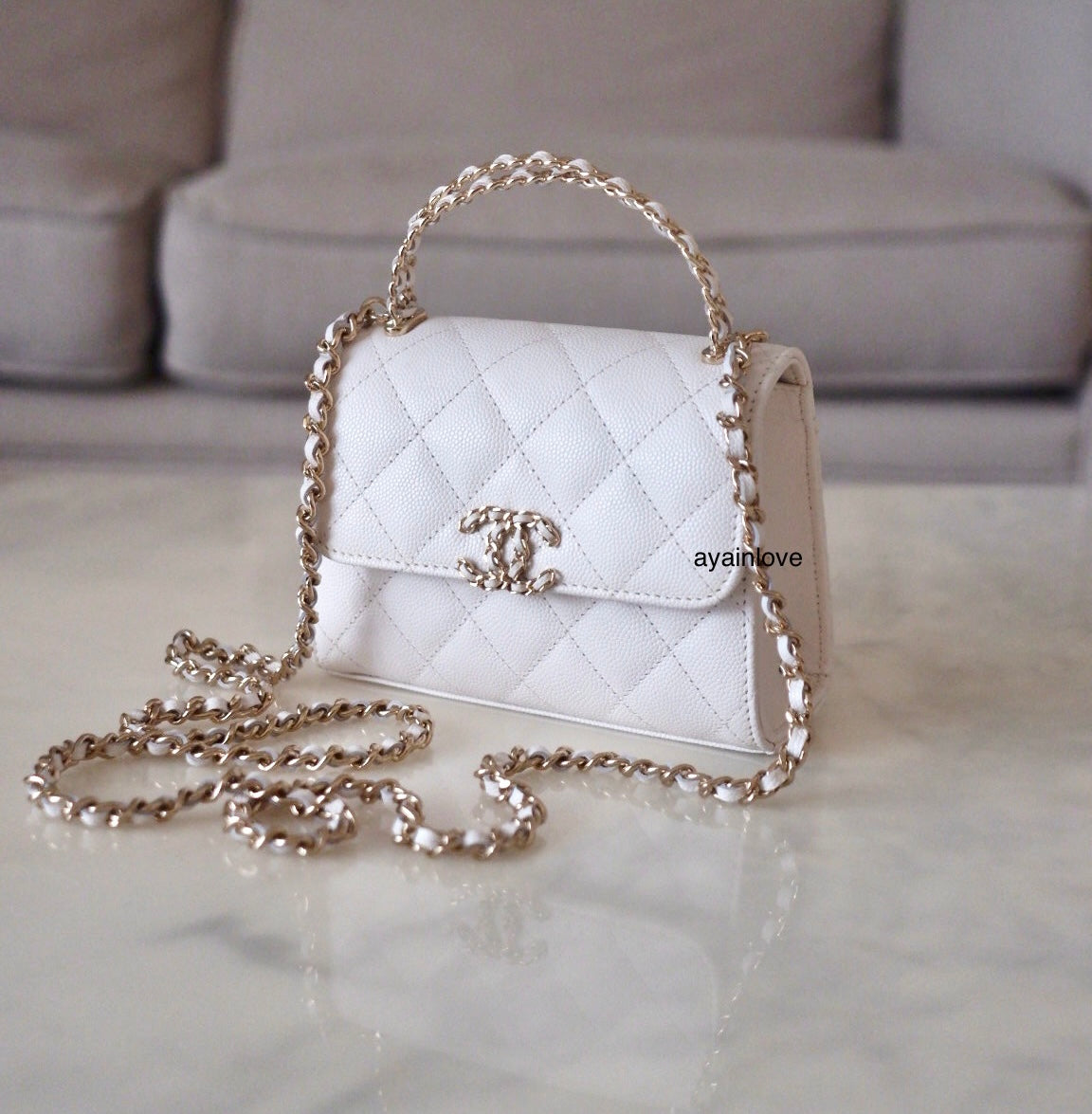 CHANEL 23P White Caviar Kelly Clutch Top Handle with Chain Light Gold Hardware