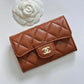 CHANEL 23A Caramel Brown Caviar Classic Small Snap Card Holder Light Gold Hardware is