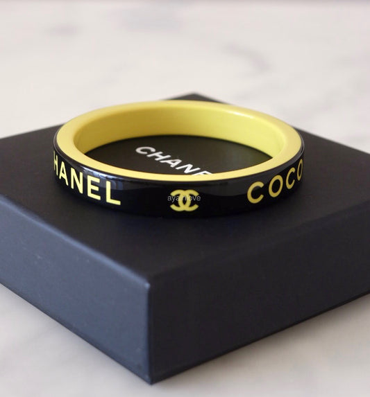 CHANEL 22S Yellow Black Resin Coco Bangle Bracelet