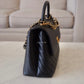 CHANEL Black Caviar Chevron Large Coco Handle 29 cm Flap Bag Brushed Gold Hardware