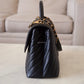 CHANEL Black Caviar Chevron Large Coco Handle 29 cm Flap Bag Brushed Gold Hardware