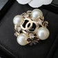 CHANEL 22S Pearl Crystal Cross Clover CC Brooch Light Gold Hardware