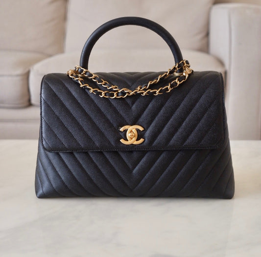 CHANEL Black Caviar Chevron Large Coco Handle 29 cm Flap Bag Brushed Gold Hardware