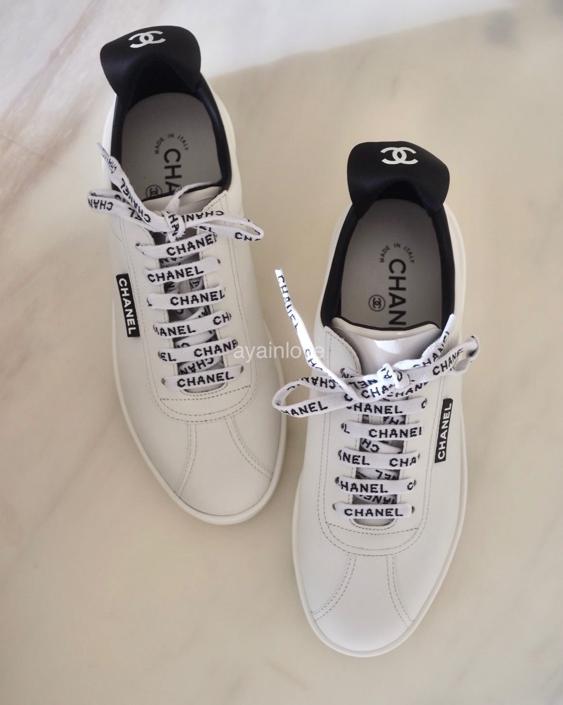 Chanel white store leather sneakers