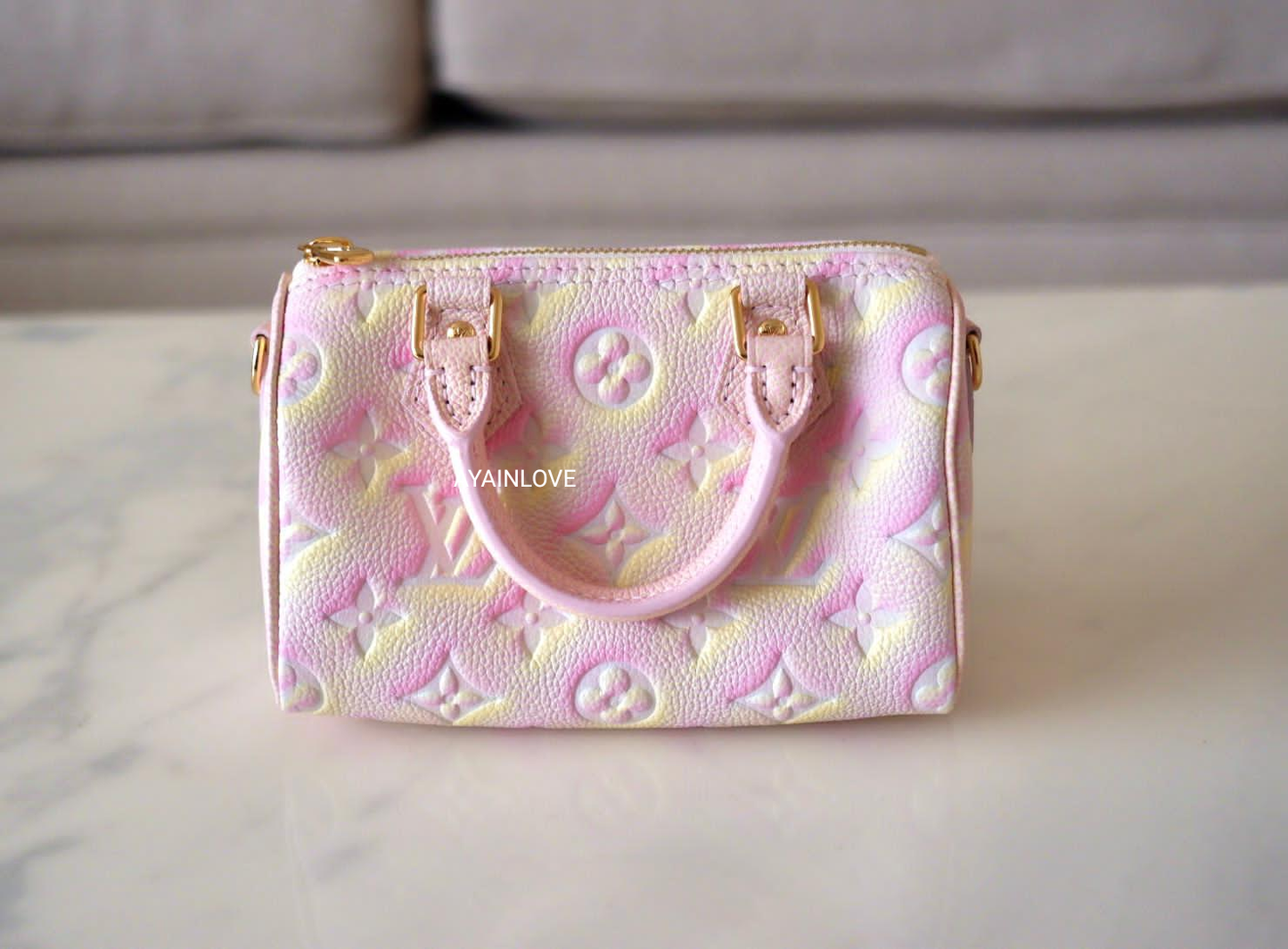 LOUIS VUITTON Nano Speedy Stardust Pink Leather Empreinte Gold Hardware