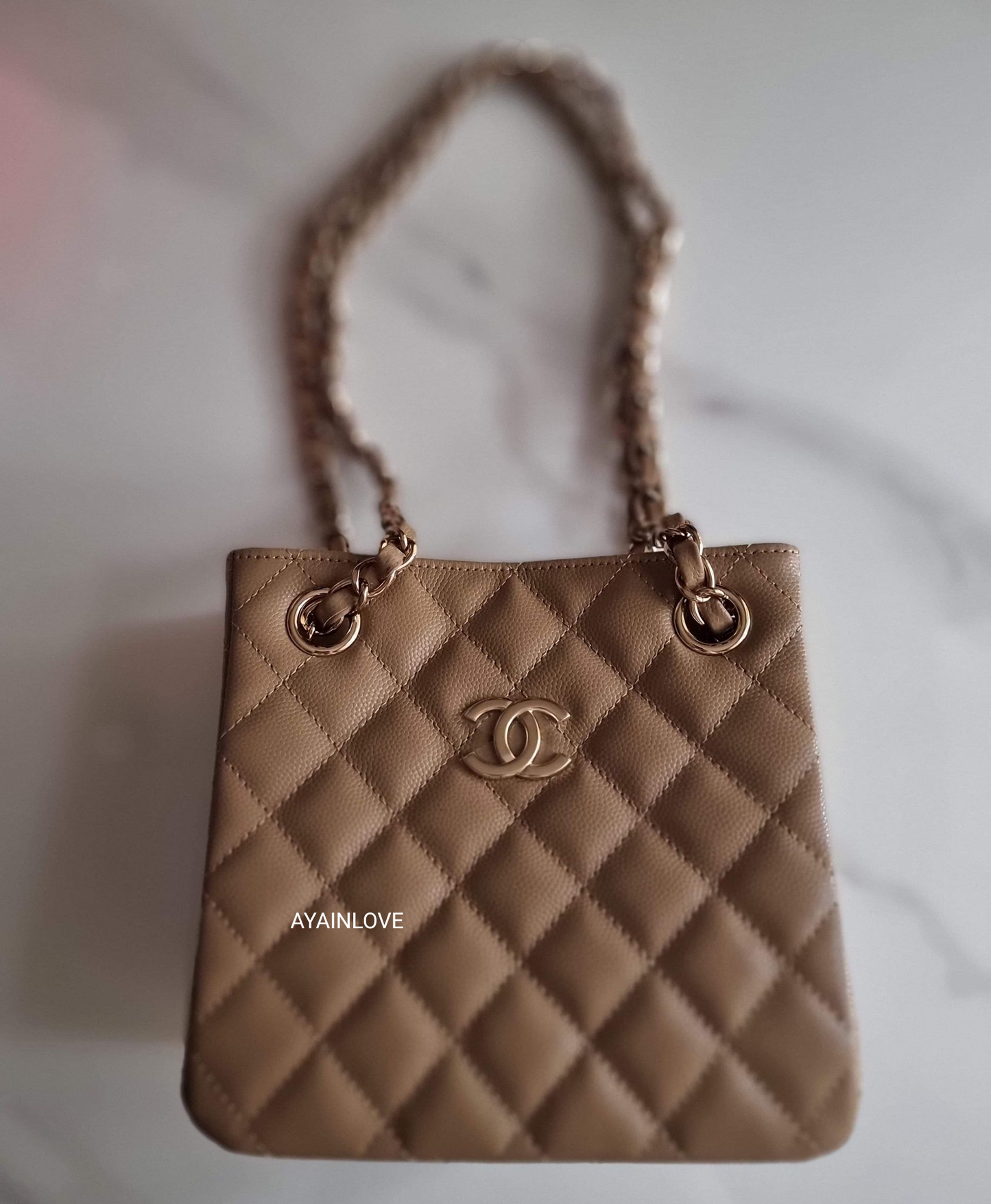 CHANEL 22A Dark Beige Caviar Mini Bucket Bag Light Gold Hardware