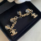 CHANEL 21P Script Dangling CC Turn-Lock Clip-On Earrings Matte Gold Hardware